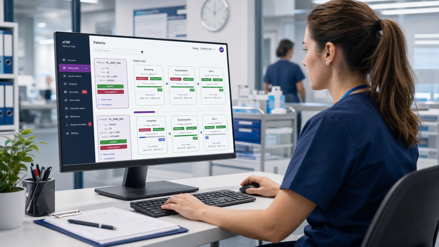 Nurse using a clinical eCRF workstation with patient visit cards and query status visible on the monitor